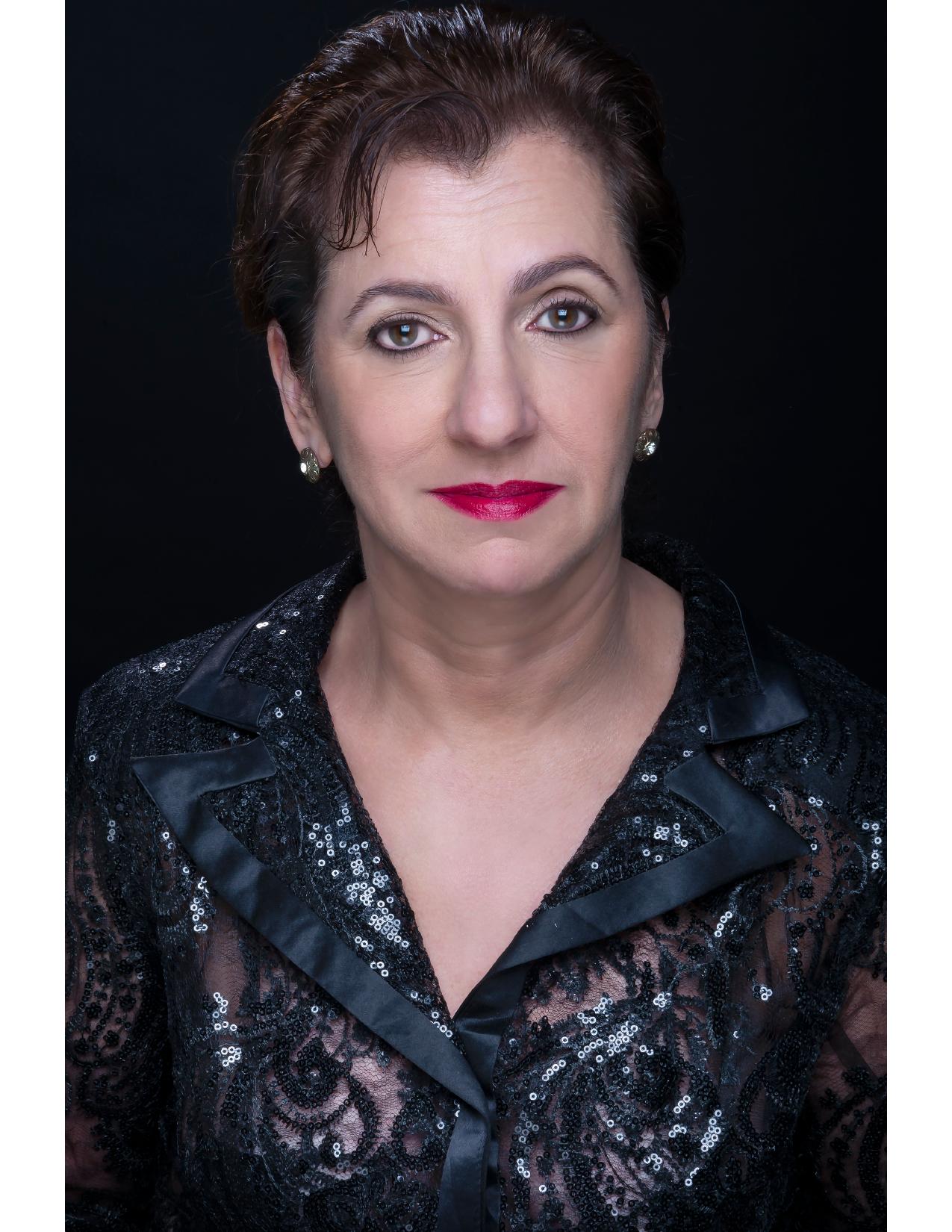Nancy Levine dramatic theatre headshot in black sequins